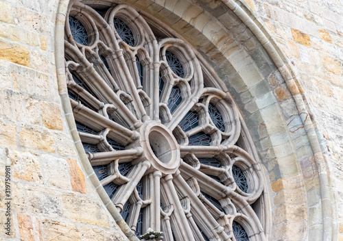 round stained glass window on church in Europe 