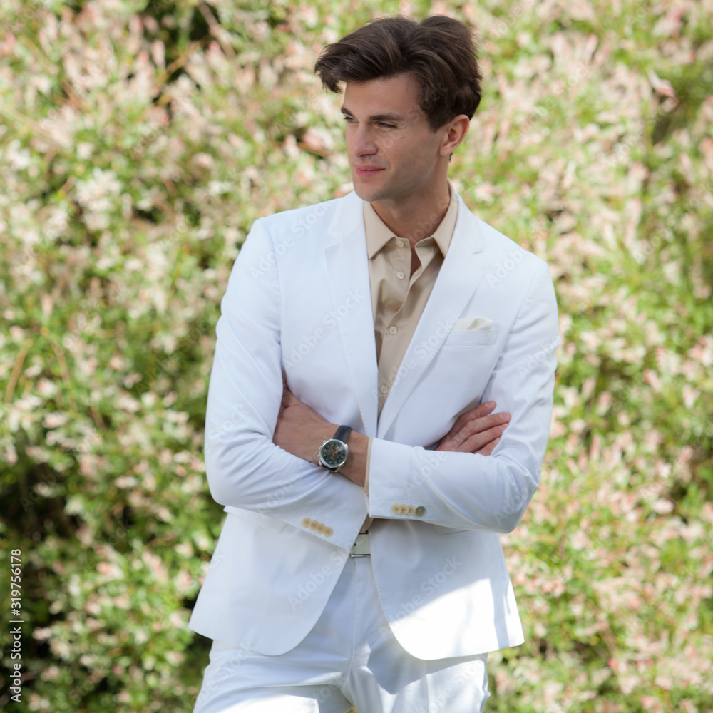 Young elegant handsome man posing outside. Young elegant handsome man posing outside.