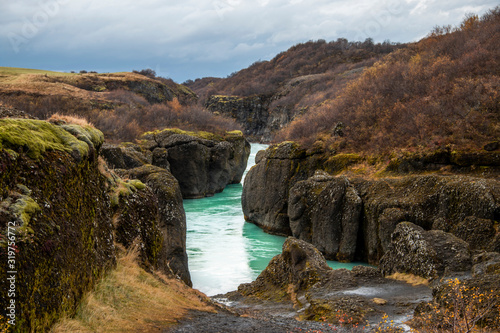 Emerald colored water in a canyon