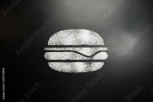 Foto Hamburger. Drawing on a black chalkboard