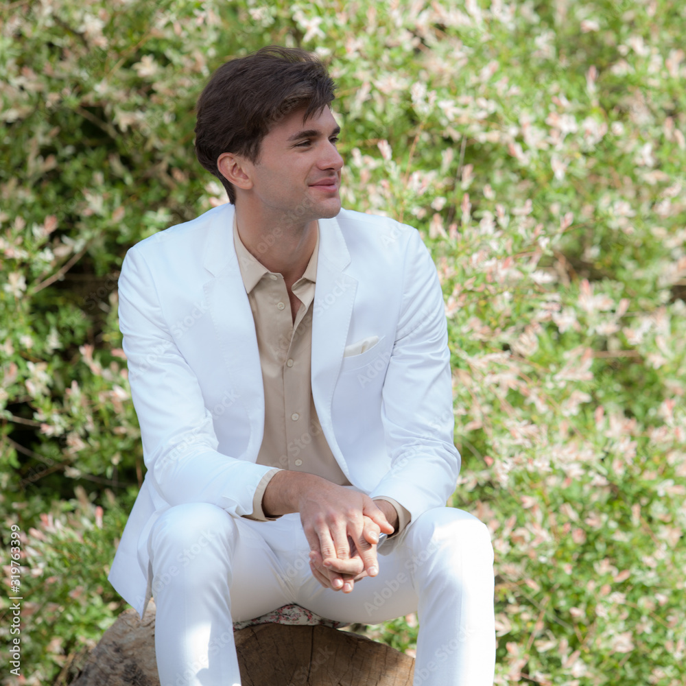Young elegant handsome man posing outside. Young elegant handsome man posing outside.