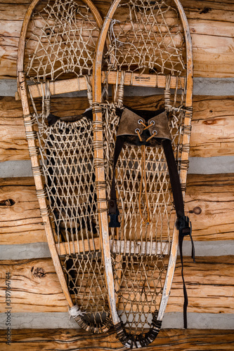 Antique snowshoes, decoration on log cabin.