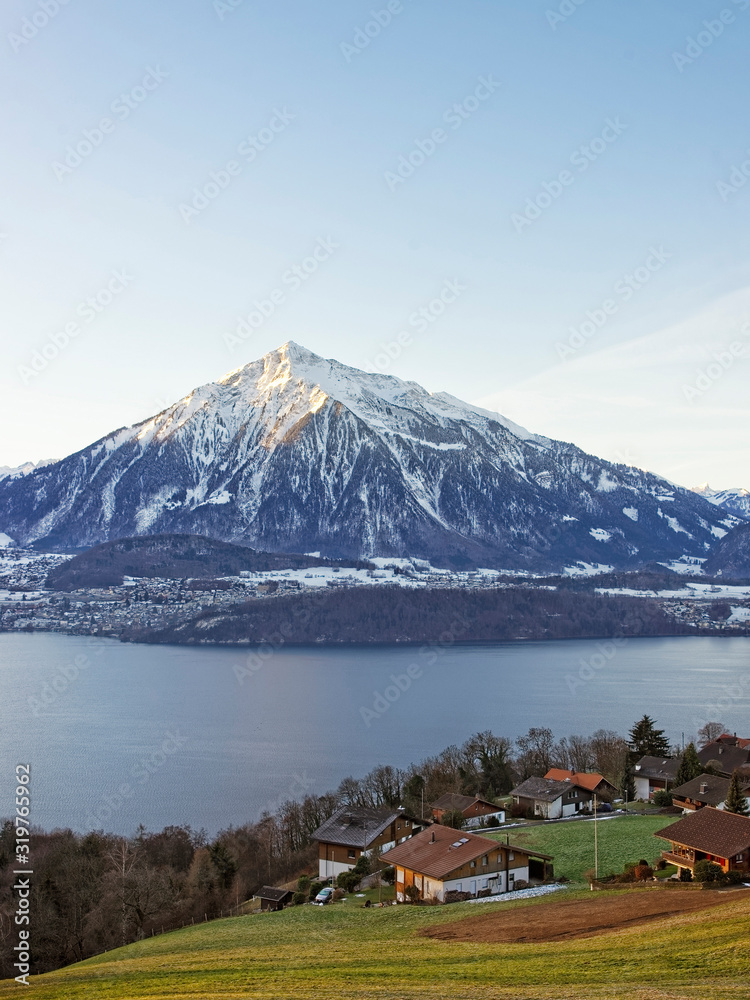 Swiss lake view near Thun with a view of Niesen mountain in winter