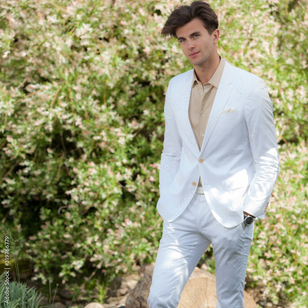 Young elegant handsome man posing outside. Young elegant handsome man posing outside.