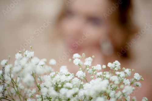 bouquet of decorative flowers against woman siilhouette photo