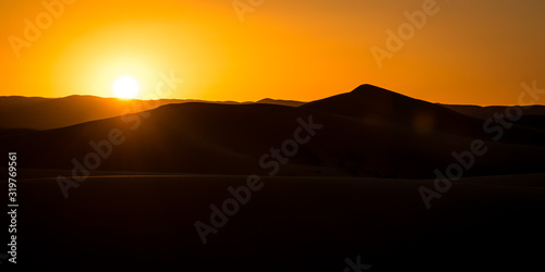 Sunset over sand dunes of Sahara, Merzouga, Morocco