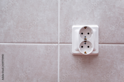 white double slider on tile wall