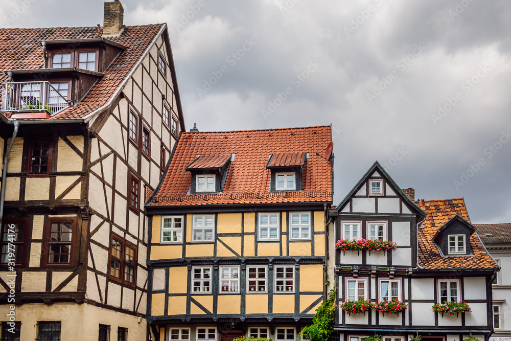 Close up view of colored facades of half -timbered houses in the old town of the medieval city of Quedlinburg, Harz, Germany. Traditional german architecture.