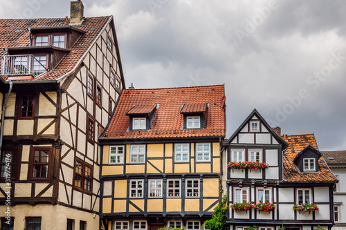 Close up view of colored facades of half -timbered houses in the old town of the medieval city of Quedlinburg, Harz, Germany. Traditional german architecture.