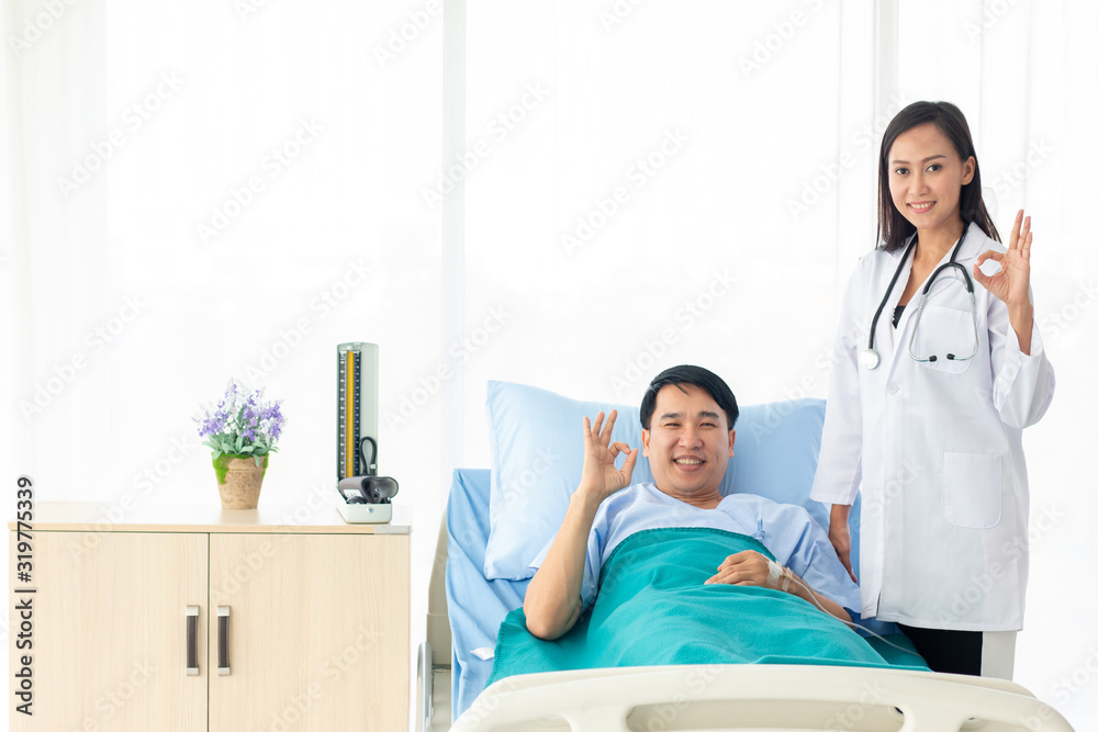 female doctor with happy patient at the hospital. female doctor with happy patient at the hospital.