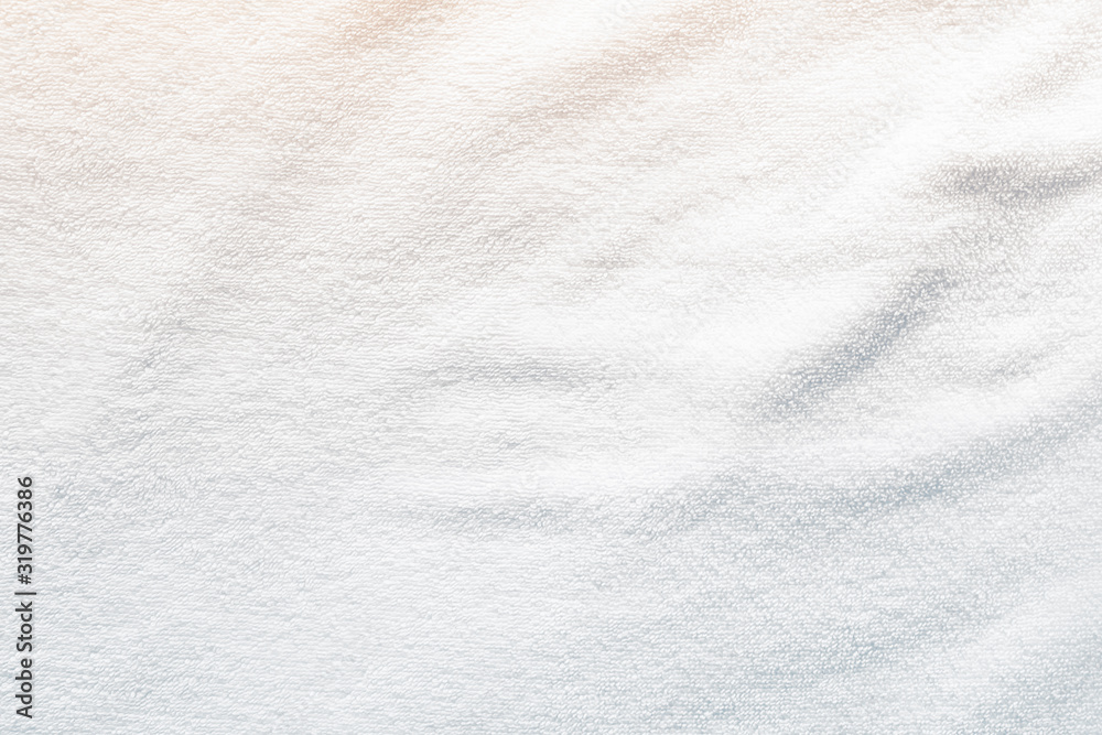White towel texture background with abstract pattern. That fabric or textile consist of cotton fiber or natural material. For absorb water, drying and wiping in bathroom, laundry and kitchen room. White towel texture background with abstract pattern. That fabric or textile consist of cotton fiber or natural material. For absorb water, drying and wiping in bathroom, laundry and kitchen room.