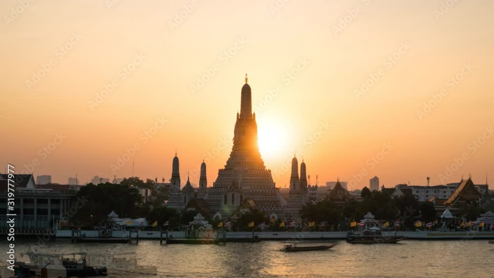 Sunset The iconic Temple of Dawn Time-lapse day to night, Wat Arun, along the Chao Phraya river with a colorful sky in Bangkok, Thailand, Tilt down. Sunset The iconic Temple of Dawn Time-lapse day to night, Wat Arun, along the Chao Phraya river with a colorful sky in Bangkok, Thailand, Tilt down.
