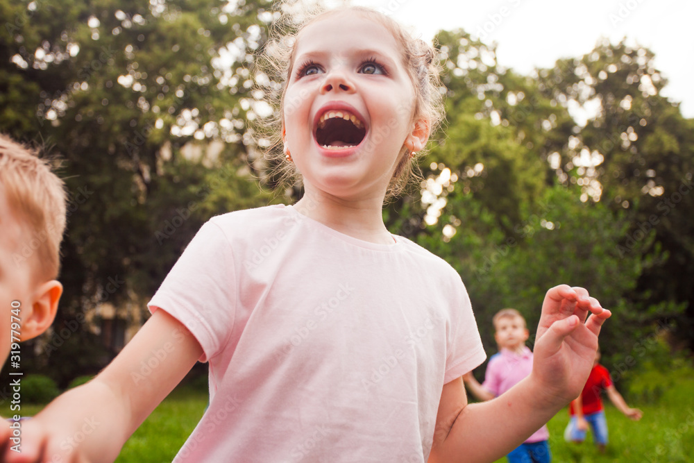 Happy kids playing on nature on a children's birthday party Happy kids playing on nature on a children's birthday party