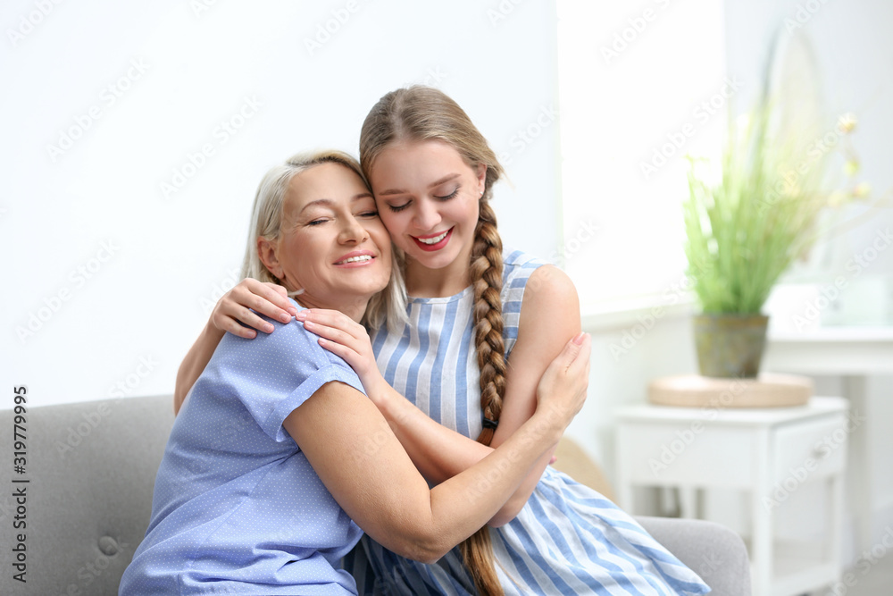 Mother and her adult daughter spending time together at home Mother and her adult daughter spending time together at home
