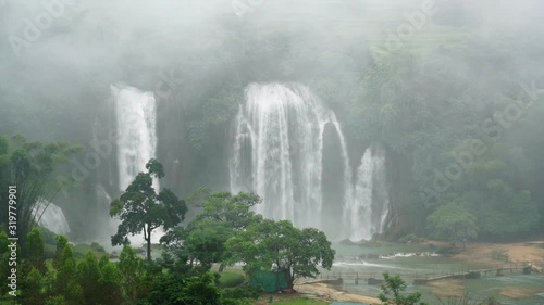Bird eye view Bangioc waterfall in Vietnam and Detian waterfall with mist surround in China, located near border, people can see this waterfall both of country, Lockdown..