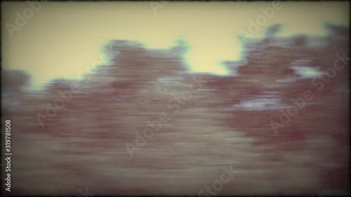 Vintage Driving - driving on a country road - hand held POV shot, that was taken out of the side window of a car - vintage style / old film look / old film projector-look - ProRes