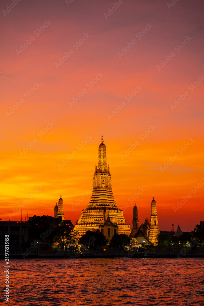 Wat Arun Ratchawararam  in the evening sky is a beautiful ancient temple built in the Ayutthaya it is where both domestic and international tourists are popular in Bangkok Thailand