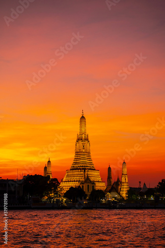 Wat Arun Ratchawararam in the evening sky is a beautiful ancient temple built in the Ayutthaya it is where both domestic and international tourists are popular in Bangkok Thailand