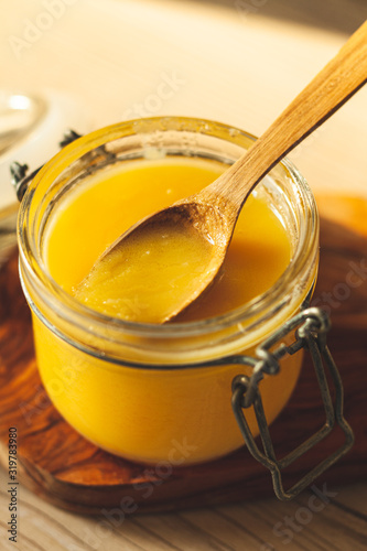 close up of wooden spoon with clarified butter