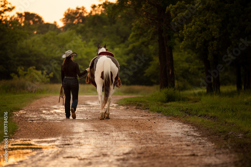 cowgirl with paint horse