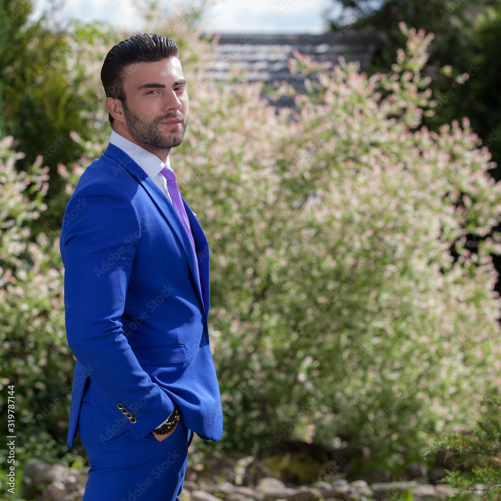 Young elegant handsome man posing outside. Young elegant handsome man posing outside.