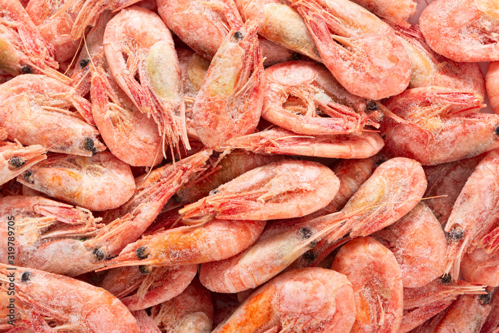 Frozen boiled wild red deep-sea shrimps as background.