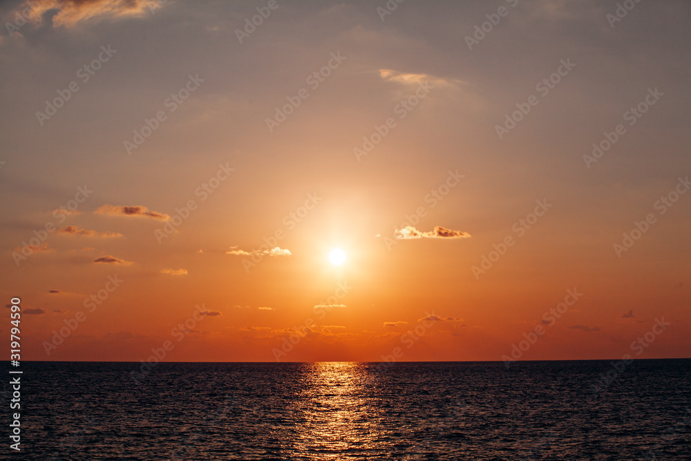 Beautiful warm sunset on the sea. Beautiful scenery. Charming sunset