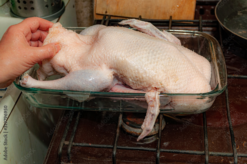 raw duck carcass in a glass baking dish raw duck carcass in a glass baking dish