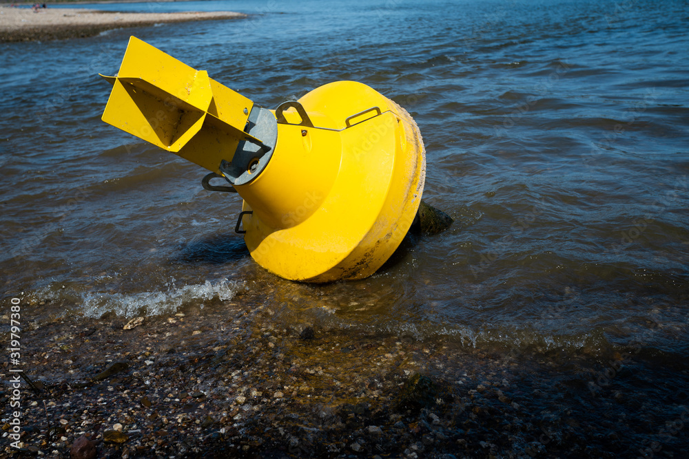 Yellow Anchor buoy on drought river Yellow Anchor buoy on drought river