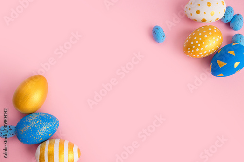 eggs golden and blue on modern beautiful pink paper