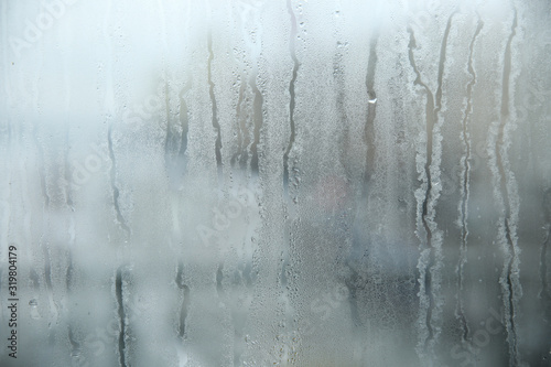 background of dirty misted glass with drops 