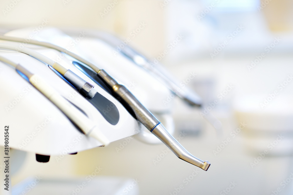 Different dental instruments and tools in a dentists office Different dental instruments and tools in a dentists office