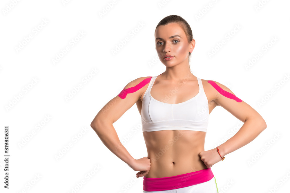 Young nice girl athlete in a white tracksuit