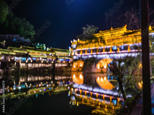 abstract Blur photo of Scenery view in the night of fenghuang old town .phoenix ancient town or Fenghuang County is a county of Hunan Province, China