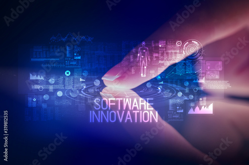 Finger touching tablet with web technology icons and SOFTWARE INNOVATION inscription