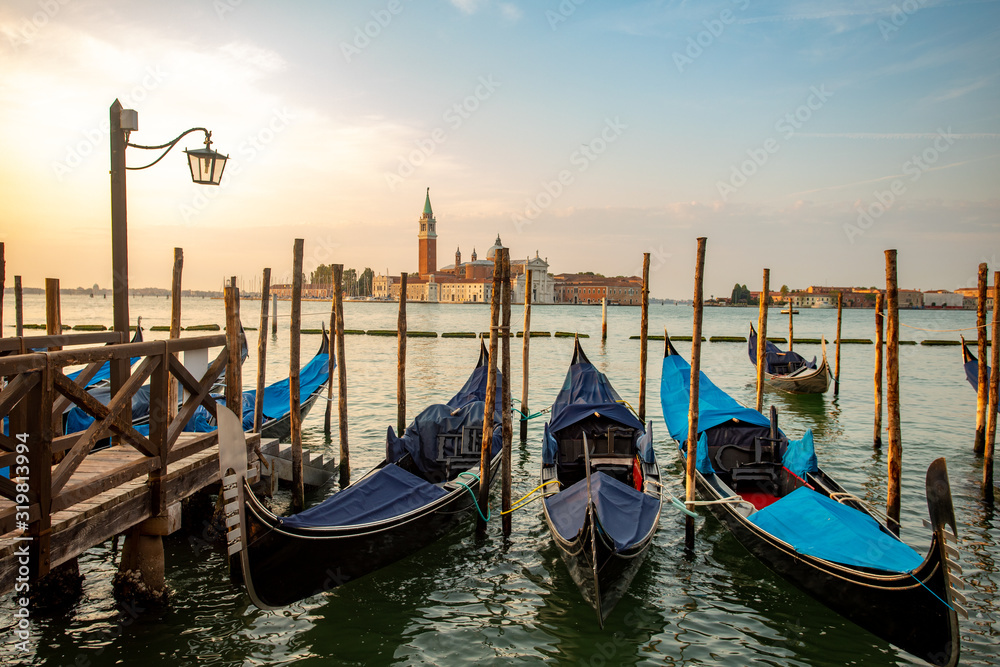 Gondolas of Venice Italy in the morning against the backdrop of sunrise