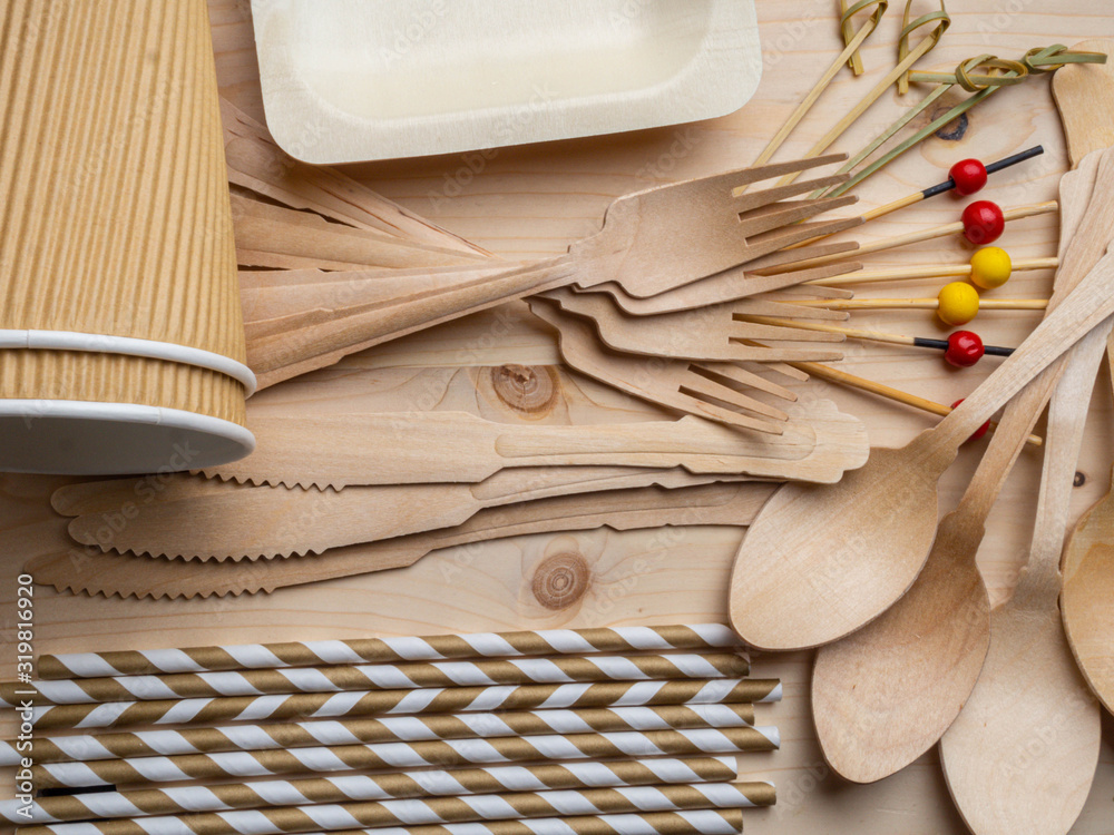 Disposable tableware from natural materials, wooden spoon, fork, knife, cup, sticks, plate, eco-friendly.