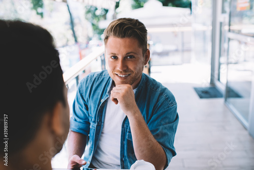 Half of handsome caucasian man in trendy wear looking at camera spending coffee break with colleague on meeting, positive confident male startupper discussing plans with partner enjoy talk. Free Download Half of handsome caucasian man in trendy wear looking at camera spending coffee break with colleague on meeting, positive confident male startupper discussing plans with partner enjoy talk. - GFXLoad