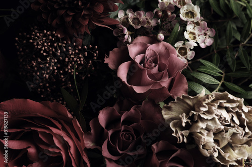 Beautiful bouquet of different flowers, closeup. Floral card design with dark vintage effect
