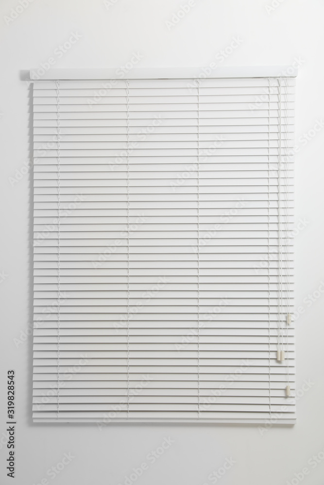 Modern window with closed blinds in room Modern window with closed blinds in room