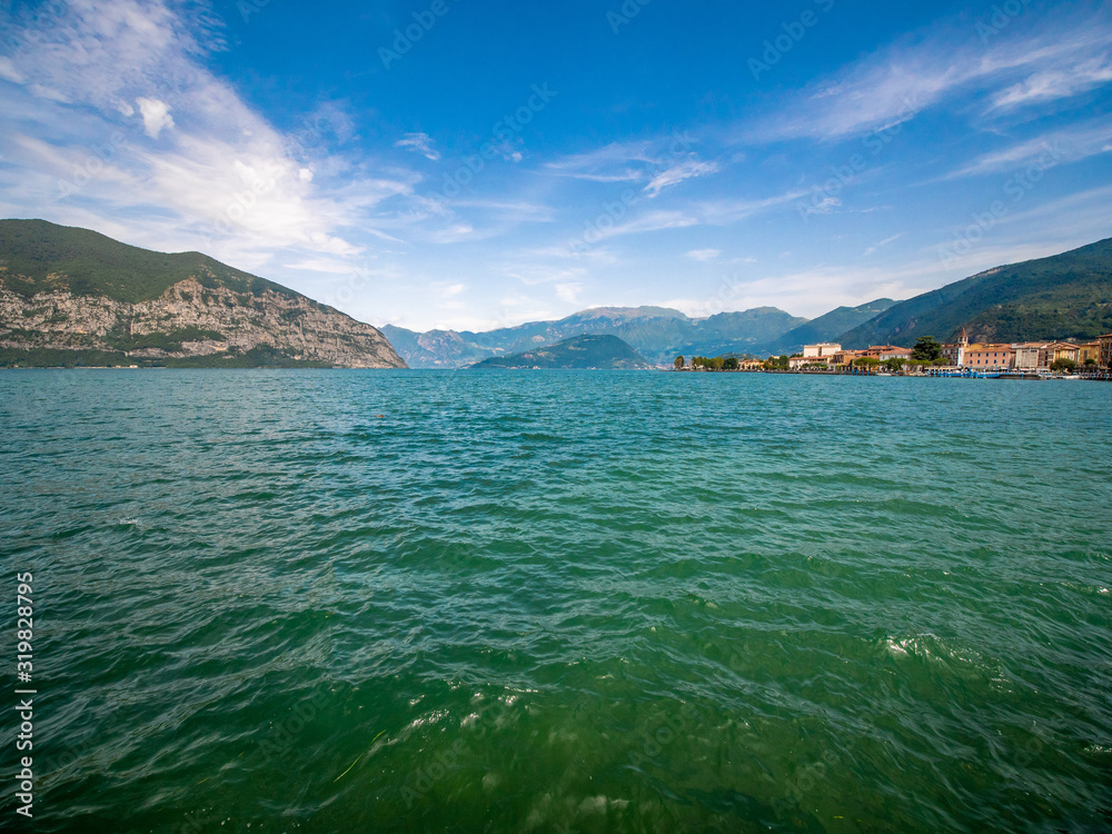 Obraz premium Lago di Garda in northern Italy, family tourism boats, crystal clear water, summer holidays vacations