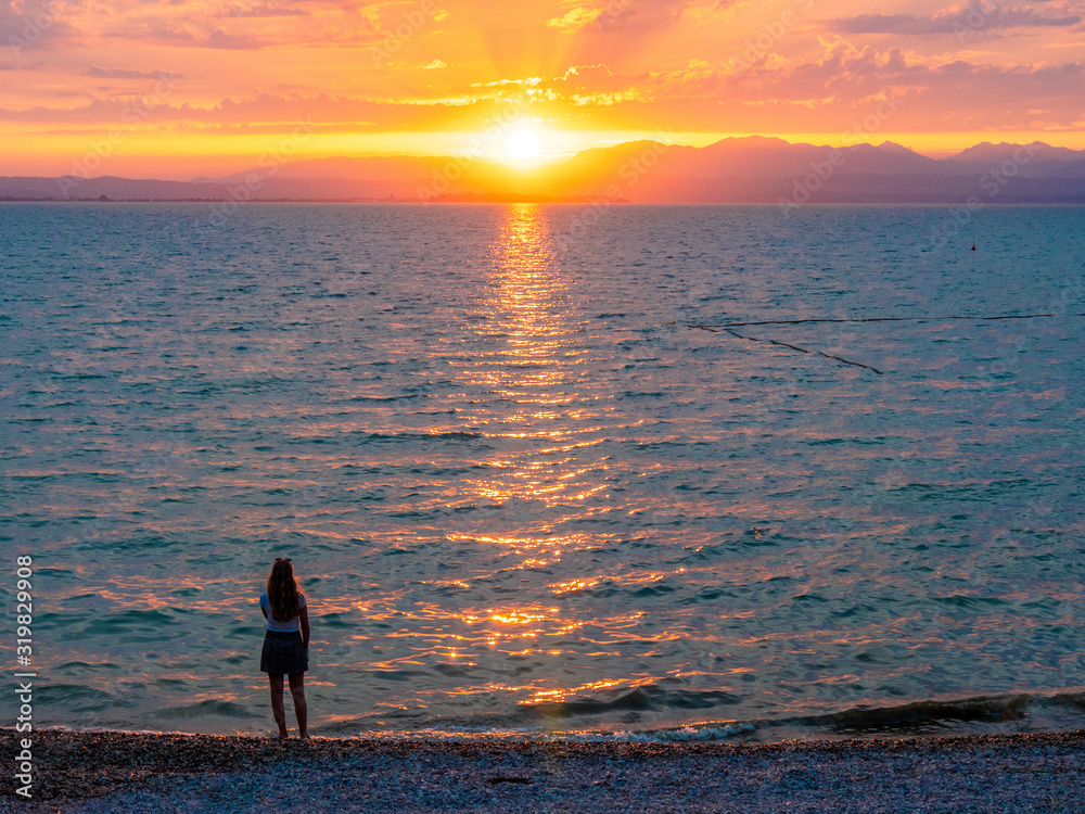 Fototapeta premium Lago di Garda in northern Italy, family tourism boats, crystal clear water, summer holidays vacations