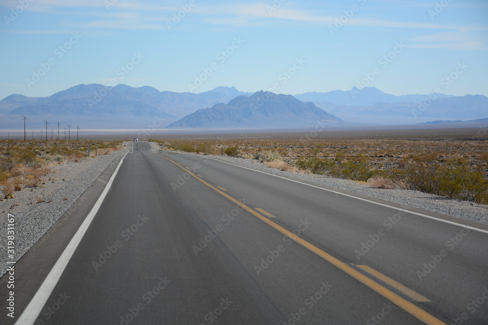 Naklejka premium Death Valley Junction, California - November 11, 2019: Road on the way to Death Valley National Park in California, USA