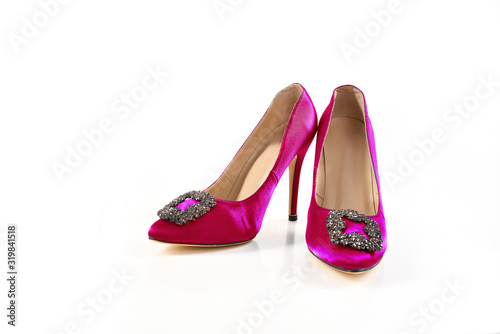 Pink patent leather shoes on a white background