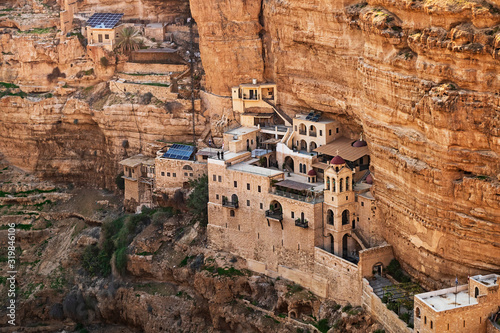 western section of the ancient saint george's monastery built into the limestone cliffs and caves of wadi qelt nahal prat near jericho in the west bank