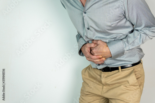 caucasian man with shirt and with his hands is his stomach