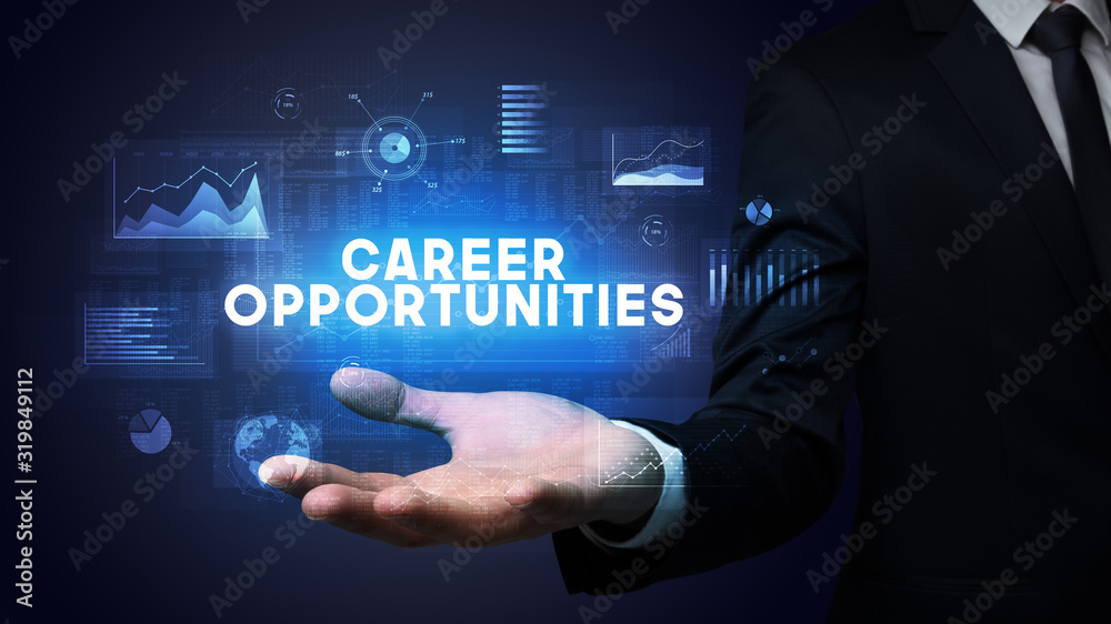 Hand of Businessman holding CAREER OPPORTUNITIES inscription, business success concept Hand of Businessman holding CAREER OPPORTUNITIES inscription, business success concept
