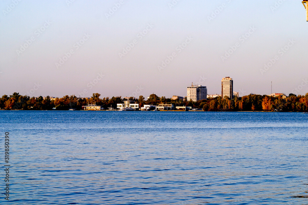 Left side of Dnipro city, Ukraine. Panoramic view of Dnipro river. Cityscape Housing estate Sunny with buildings.
