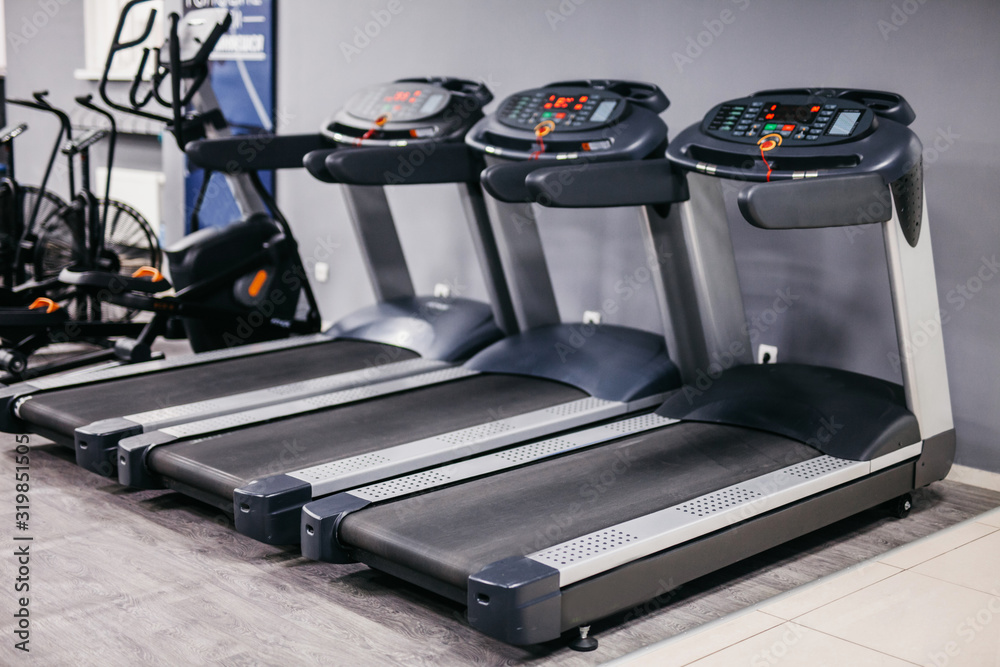 three treadmills in a sports hall