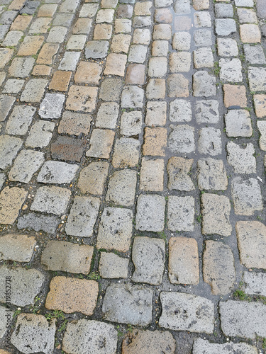 Vintage traditional stone pavement. Cobblestone pavement texture and abstract background concept.